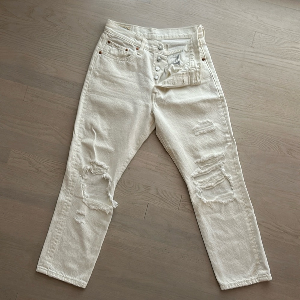 Levi’s 501 distressed cream colored size 27 jeans lightly worn